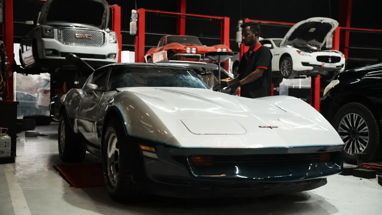A classic C3 Corvette in the bay at Al Zaabi Autocare, Mussafah