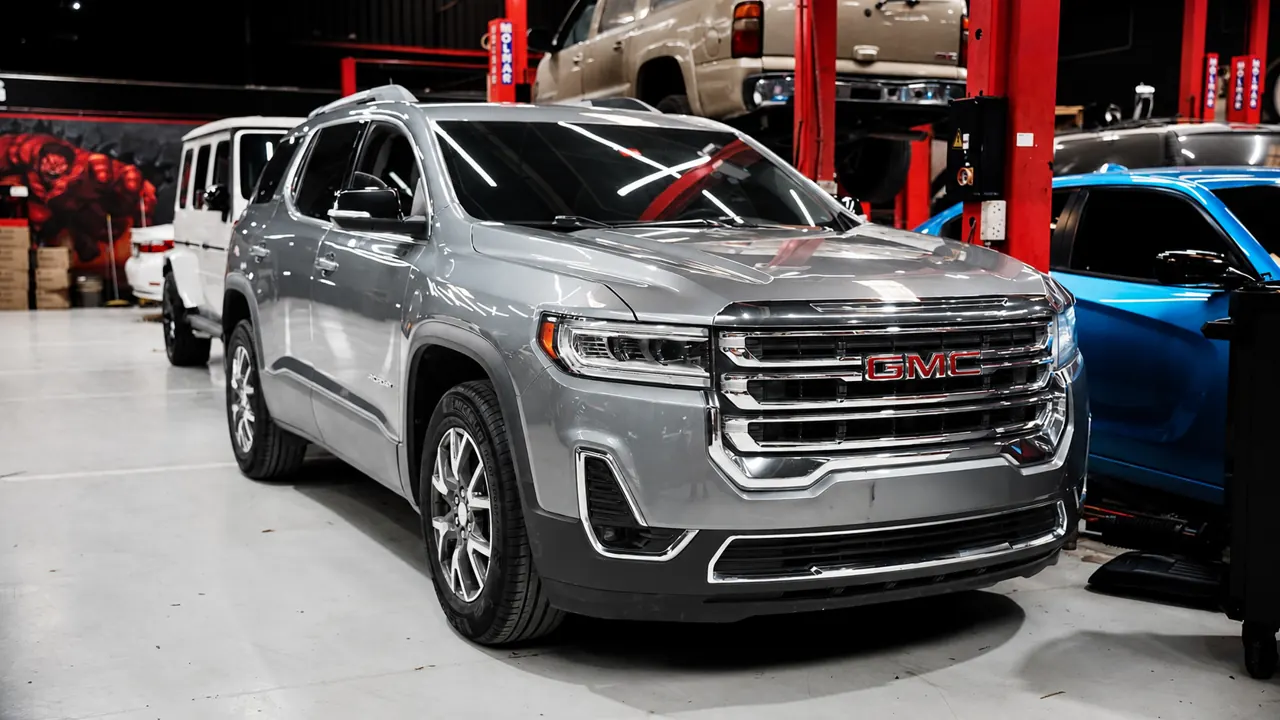 A GMC Acadia in the bay at Al Zaabi Autocare, Mussafah
