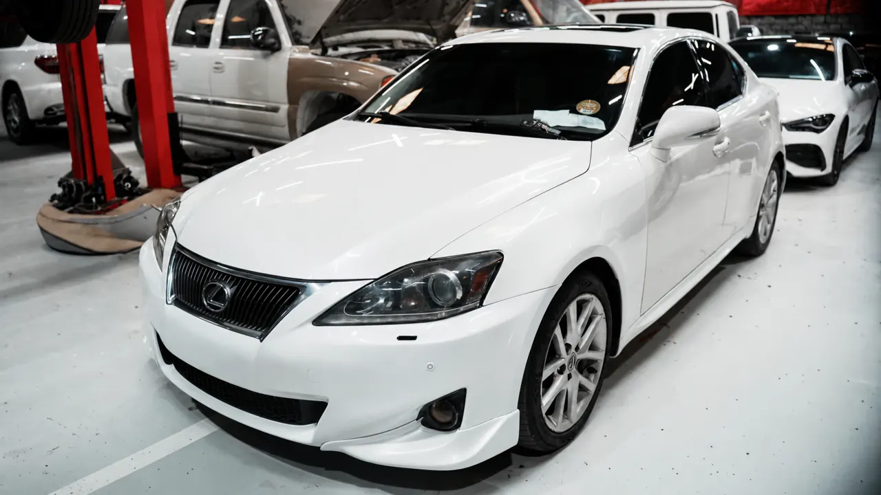 A Lexus IS in the bay at Al Zaabi Autocare, Mussafah