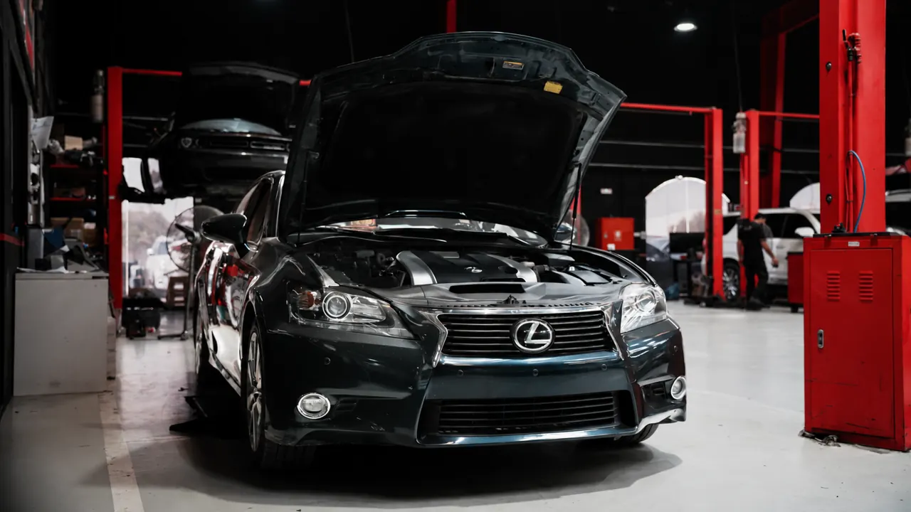 A Lexus GS with the bonnet up in the bay at Al Zaabi Autocare, Mussafah